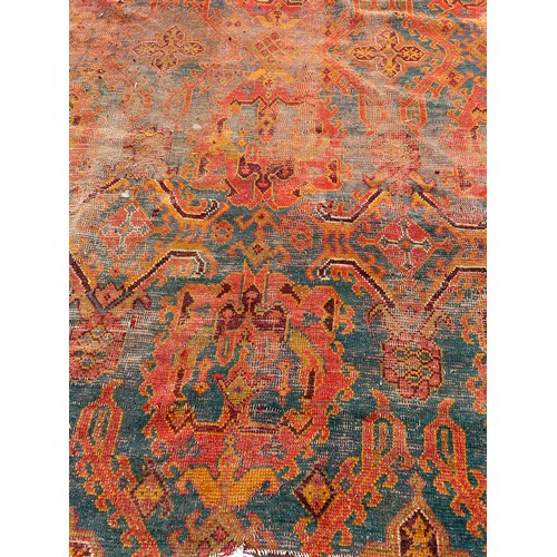 880 - A VERY LARGE ANTIQUE BLUE GROUND OUSHAK CARPET, 

Now fragmentary, and badly damaged. 

490cm x 390c... 