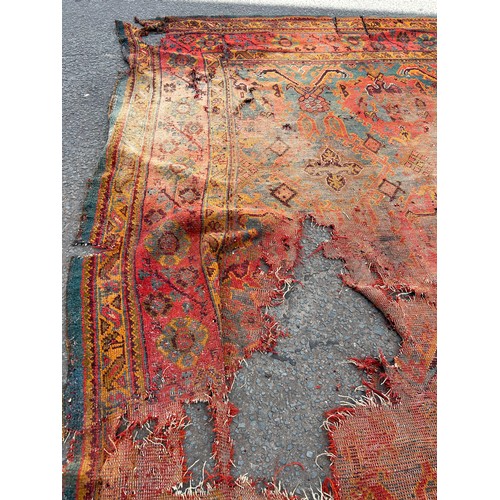 880 - A VERY LARGE ANTIQUE BLUE GROUND OUSHAK CARPET, 

Now fragmentary, and badly damaged. 

490cm x 390c... 