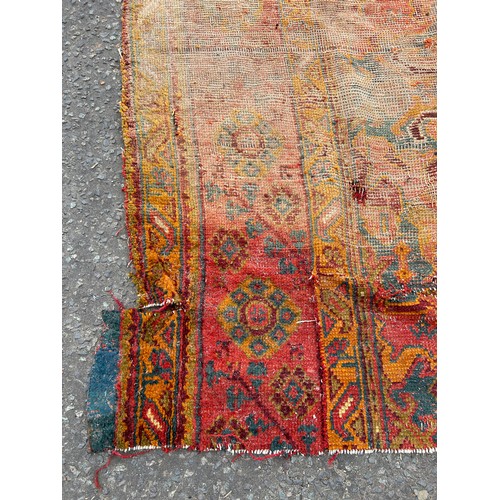 880 - A VERY LARGE ANTIQUE BLUE GROUND OUSHAK CARPET, 

Now fragmentary, and badly damaged. 

490cm x 390c... 