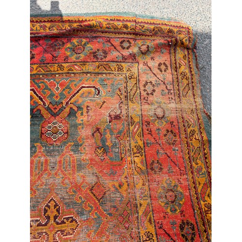 880 - A VERY LARGE ANTIQUE BLUE GROUND OUSHAK CARPET, 

Now fragmentary, and badly damaged. 

490cm x 390c... 