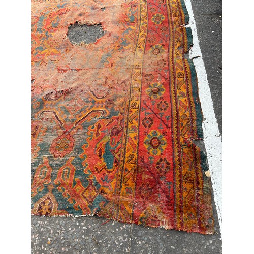 880 - A VERY LARGE ANTIQUE BLUE GROUND OUSHAK CARPET, 

Now fragmentary, and badly damaged. 

490cm x 390c... 