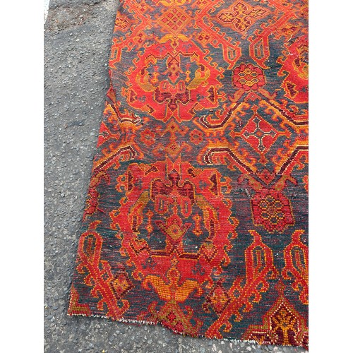 880 - A VERY LARGE ANTIQUE BLUE GROUND OUSHAK CARPET, 

Now fragmentary, and badly damaged. 

490cm x 390c... 