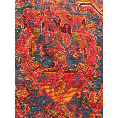 880 - A VERY LARGE ANTIQUE BLUE GROUND OUSHAK CARPET, 

Now fragmentary, and badly damaged. 

490cm x 390c... 