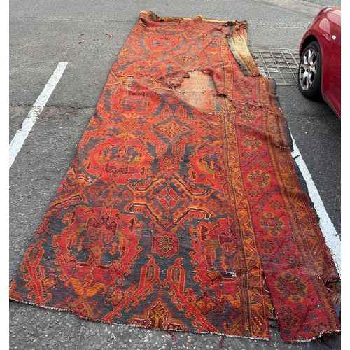 880 - A VERY LARGE ANTIQUE BLUE GROUND OUSHAK CARPET, 

Now fragmentary, and badly damaged. 

490cm x 390c... 