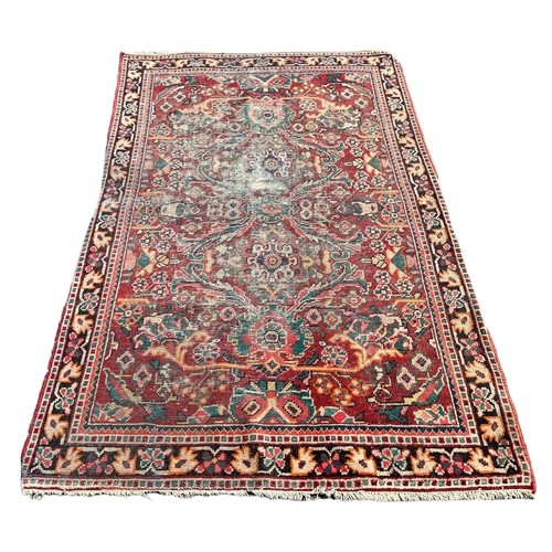 883 - A PERSIAN DESIGN CARPET, 

205cm x 130cm