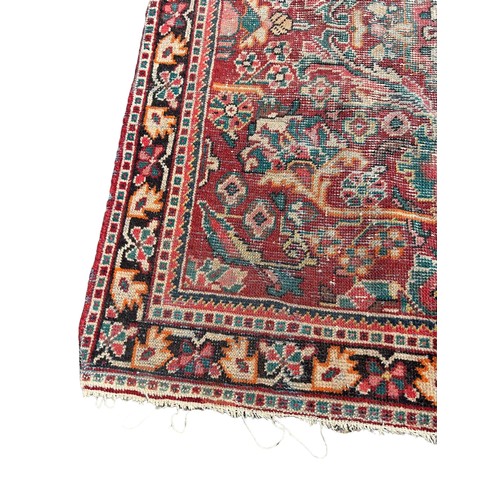 883 - A PERSIAN DESIGN CARPET, 

205cm x 130cm