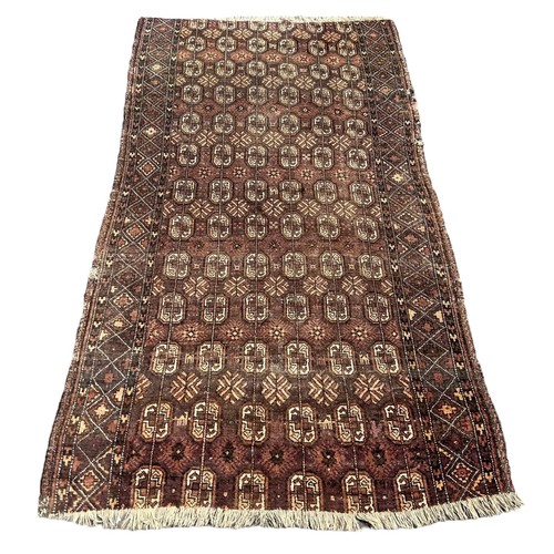 885 - A PERSIAN DESIGN BOKHARA CARPET, 

235cm x 125cm