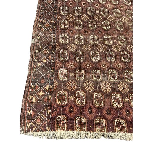 885 - A PERSIAN DESIGN BOKHARA CARPET, 

235cm x 125cm