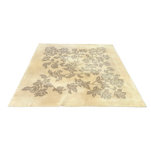 889 - A LARGE JAPANESE CARPET WITH FLOWERS, 

255cm x 255cm