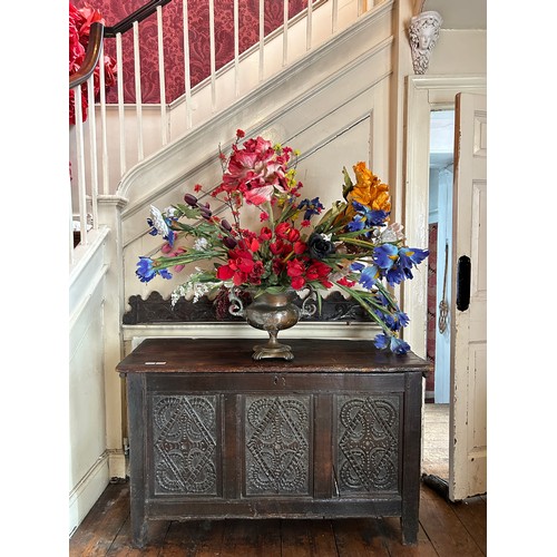 6 - A LARGE TWIN HANDLED BRASS VASE FILLED WITH DECORATIVE FAUX FLOWERS, 

Vase 37cm x 30cm