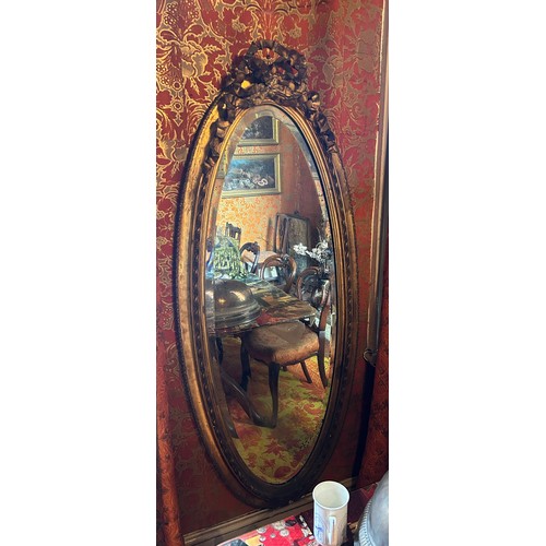 18 - A LARGE FRENCH OVAL GILT WOOD WALL MIRROR WITH RIBBON DECORATION, 

153cm x 66cm