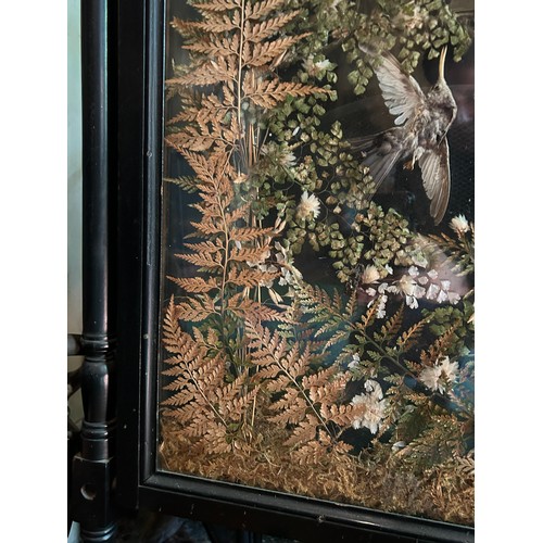 39 - A LATE 19TH CENTURY AESTHETIC PERIOD EBONISED FIRE SCREEN WITH PRESSED TAXIDERMY BIRDS AND FLOWERS,
... 