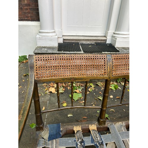 47 - A REGENCY PERIOD GREEN PAINTED FAUX BAMBOO SETTLE WITH CANEED BACK AND SEAT, 

180cm x 87cm x 67cm