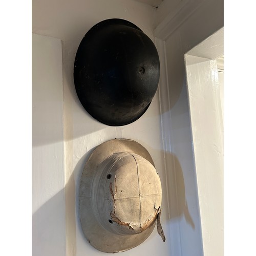 64 - A SET OF THREE MILITARY HELMETS, 

Largest 33cm x 25cm