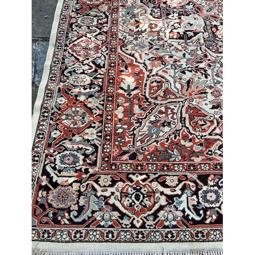 77 - A LARGE WOOL CARPET