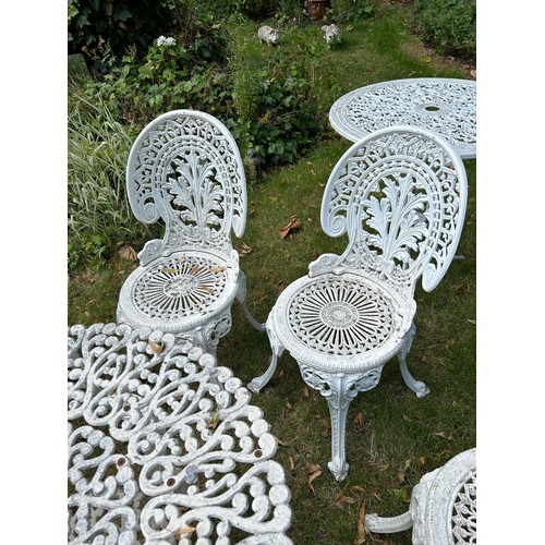 109 - A CIRCULAR GARDEN TABLE WITH VARIOUS ALUMNIUM CHAIRS MANY IN THE COALBROOKDALE STYLE,  

Each chair ... 