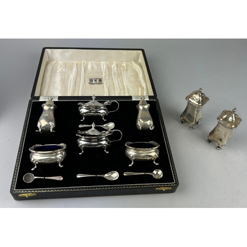 129 - A CASED SILVER CRUET AND SHAKER SET, ALONG WITH TWO SILVER SHAKERS, 

Total silver weight (excluding... 