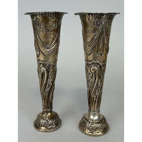 136 - A PAIR OF SILVER POSY VASES, 

Marked for London, 'WC JL',

14cm H 

Weighted. 

Total weight: 325gm... 