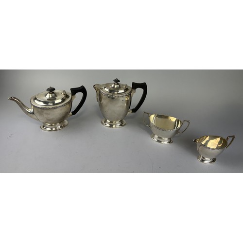 140 - A SILVER TEA SERVICE BY JAMES DEAKIN AND SONS COMPRISING OF A TEA POT, HOT WATER POT, SUGAR BOWL AND... 