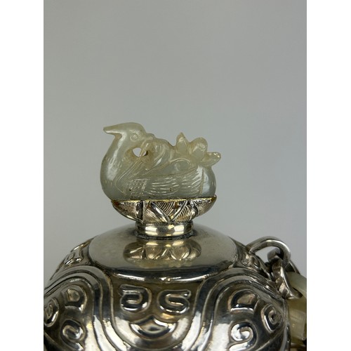 160 - AN EARLY 20TH CENTURY CHINESE WHITE METAL POT IN THE MONGOLIAN STYLE WITH HARDSTONES, JADE PLAQUE AN... 