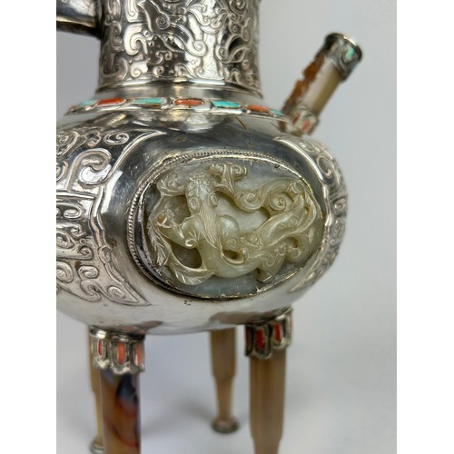 160 - AN EARLY 20TH CENTURY CHINESE WHITE METAL POT IN THE MONGOLIAN STYLE WITH HARDSTONES, JADE PLAQUE AN... 