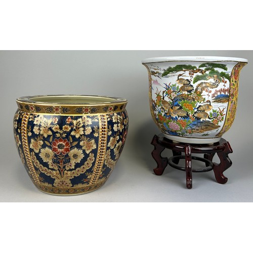 818 - TWO JAPANESE CERAMIC PLANTERS, 

Largest 30cm x 23cm 

One with wooden stand.