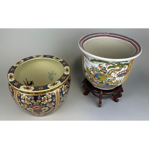 818 - TWO JAPANESE CERAMIC PLANTERS, 

Largest 30cm x 23cm 

One with wooden stand.