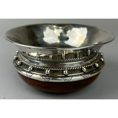 131 - ALBERT EDWARD JONES (BRITISH 1878-1954): A SILVER AND TURNED WOOD ARTS AND CRAFTS CUP, 

14cm x 7cm