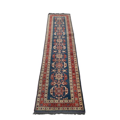 847 - A PERSIAN DESIGN RUNNER, 

318cm x 74cm