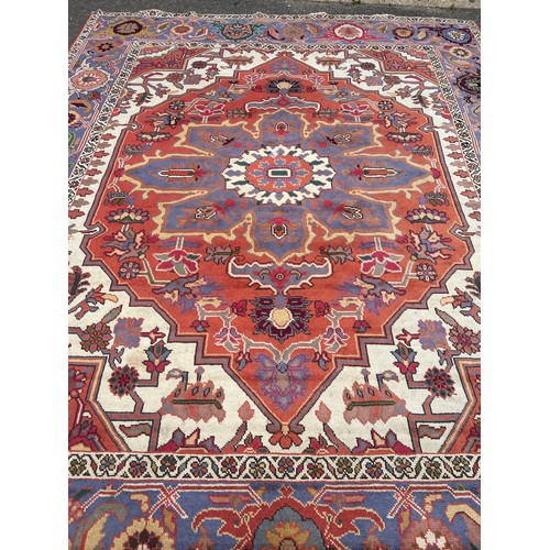 849 - A LARGE PERSIAN DESIGN CARPET,

400cm x 315cm