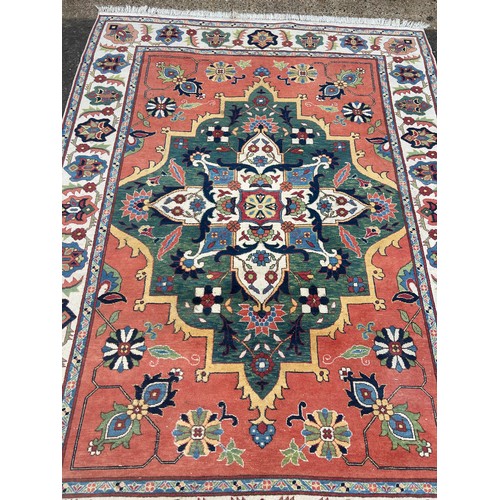 850 - A PERSIAN DESIGN CARPET,

300cm x 220cm