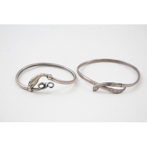 184 - TWO SILVER 1940'S SNAKE BANGLES INCLUDING GEM SET EYES,

Weight: 14gms