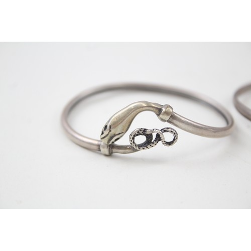 184 - TWO SILVER 1940'S SNAKE BANGLES INCLUDING GEM SET EYES,

Weight: 14gms