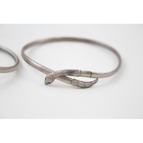 184 - TWO SILVER 1940'S SNAKE BANGLES INCLUDING GEM SET EYES,

Weight: 14gms