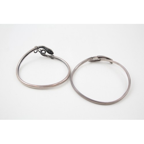 184 - TWO SILVER 1940'S SNAKE BANGLES INCLUDING GEM SET EYES,

Weight: 14gms