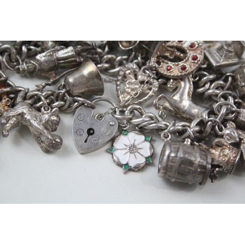 181 - SILVER CHARM BRACELET WITH TRANSPORT CHARMS,

Weight: 101gms