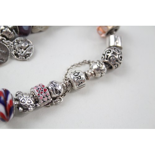 187 - SILVER PANDORA CHARM BRACELET AND CHARMS INCLUDING FAMILY,

Weight: 63gms