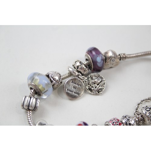 187 - SILVER PANDORA CHARM BRACELET AND CHARMS INCLUDING FAMILY,

Weight: 63gms