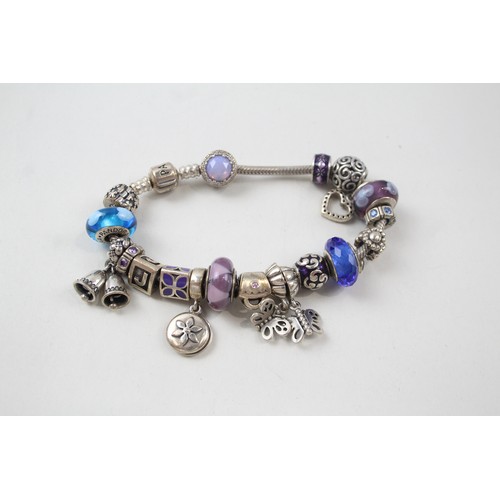 186 - SILVER PANDORA CHARM BRACELET AND CHARMS INCLUDING GLASS,

Weight: 72gms