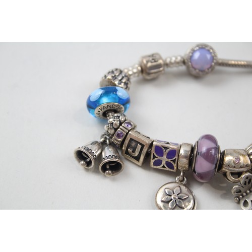 186 - SILVER PANDORA CHARM BRACELET AND CHARMS INCLUDING GLASS,

Weight: 72gms