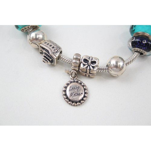 188 - SILVER PANDORA CHARM BRACELET AND CHARMS INCLUDING SAFETY CHAIN, 

Weight: 52gms