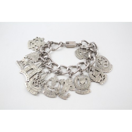 182 - A SILVER CHARM BRACELET WITH SOUVENIR CHARMS, 

Weight: 70gms