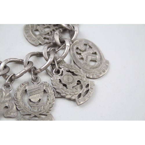 182 - A SILVER CHARM BRACELET WITH SOUVENIR CHARMS, 

Weight: 70gms