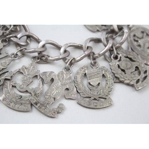 182 - A SILVER CHARM BRACELET WITH SOUVENIR CHARMS, 

Weight: 70gms