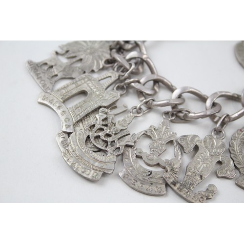 182 - A SILVER CHARM BRACELET WITH SOUVENIR CHARMS, 

Weight: 70gms