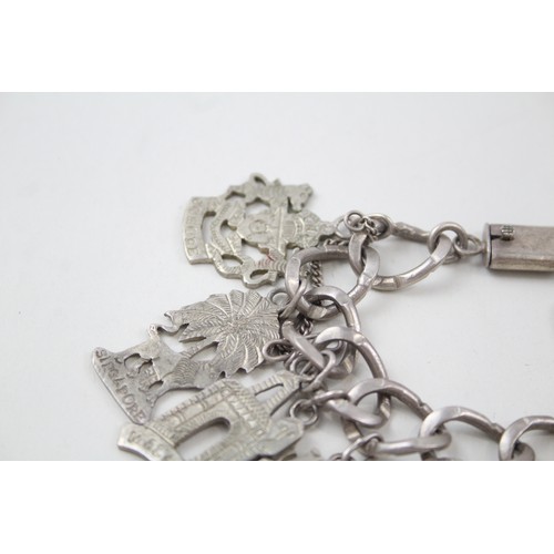 182 - A SILVER CHARM BRACELET WITH SOUVENIR CHARMS, 

Weight: 70gms