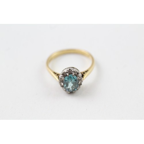 211 - AN 18CT GOLD, DIAMOND AND ZIRCON OVAL HALO RING, 

Weight: 2.9gms