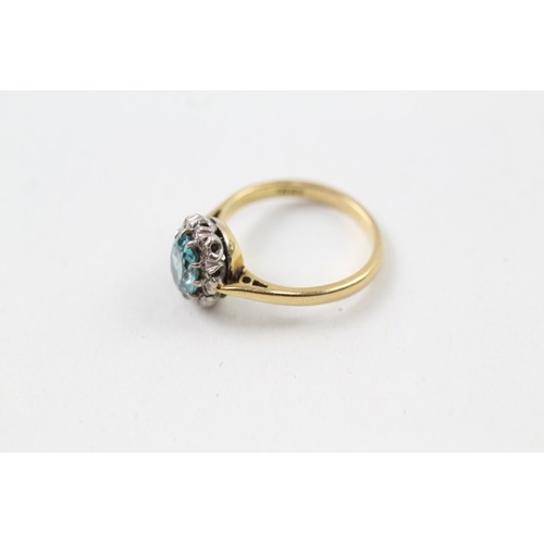 211 - AN 18CT GOLD, DIAMOND AND ZIRCON OVAL HALO RING, 

Weight: 2.9gms