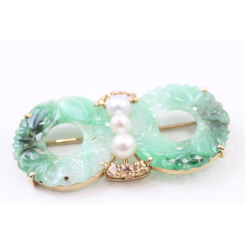 214 - AN 18CT GOLD AND CARVED JADE HOLOLITHS, CULTURED PEARLS AND YELLOW GEMSTONE SET BROOCH,

Weight: 11.... 