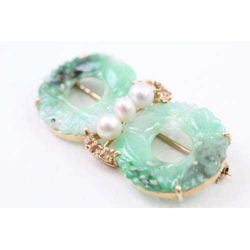 214 - AN 18CT GOLD AND CARVED JADE HOLOLITHS, CULTURED PEARLS AND YELLOW GEMSTONE SET BROOCH,

Weight: 11.... 